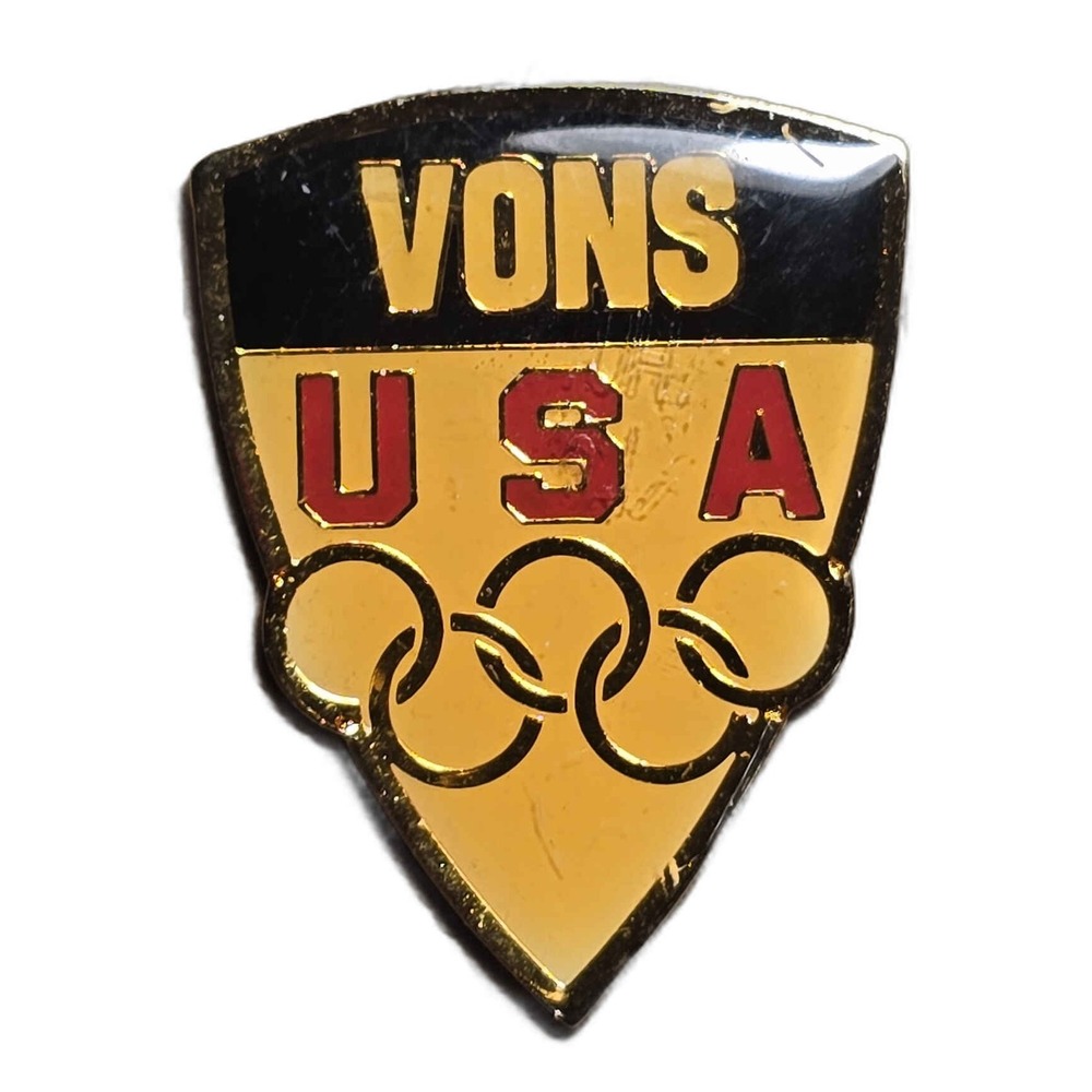 Vons USA Olympic Games 1984 Sponsor Shield Lapel Vest Hat Pin H32